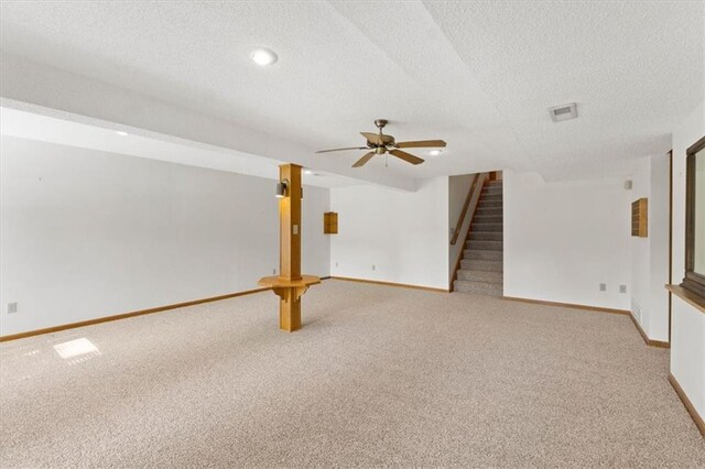 3000 Cedar Crest Dr, Independence, MO 64057 - spare room with light colored carpet, a textured ceiling, stairs, baseboards, and ceiling fan
