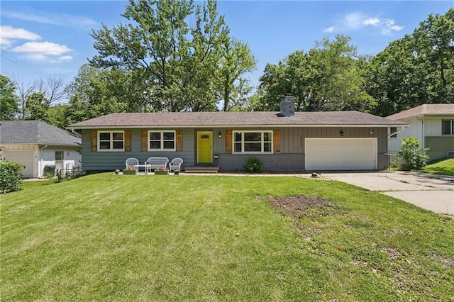 10621 E 32nd St, Independence, MO 64052 - ranch-style home featuring a chimney, a garage, driveway, and a front lawn
