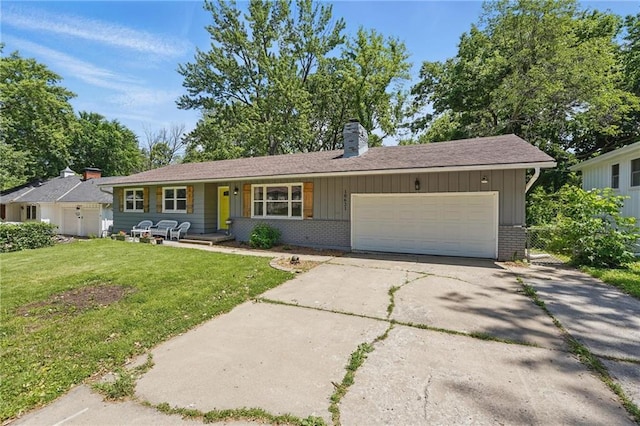 10621 E 32nd St, Independence, MO 64052 - ranch-style home with brick siding, a front lawn, a garage, a chimney, and driveway