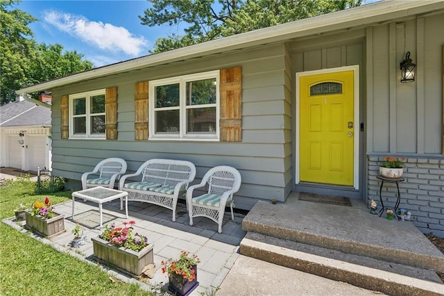 10621 E 32nd St, Independence, MO 64052 - property entrance featuring board and batten siding and a garage