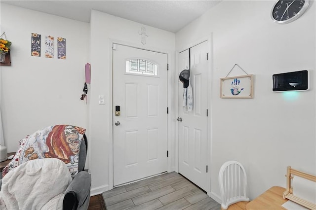 10621 E 32nd St, Independence, MO 64052 - entrance foyer with light wood-style flooring and baseboards