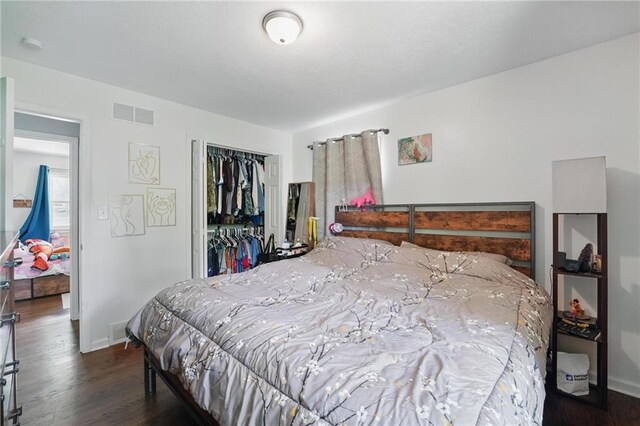 10621 E 32nd St, Independence, MO 64052 - bedroom featuring wood finished floors, baseboards, and a closet