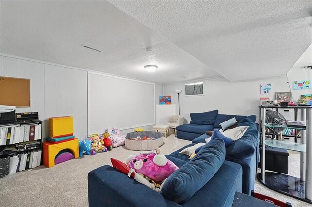 10621 E 32nd St, Independence, MO 64052 - carpeted living area with a textured ceiling