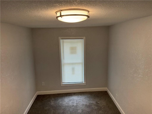 116 N Home St, Independence, MO 64053 - unfurnished room featuring a textured ceiling, carpet flooring, and baseboards