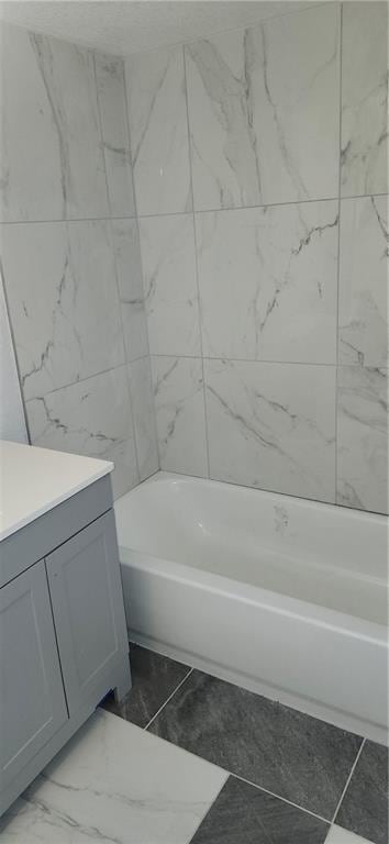 116 N Home St, Independence, MO 64053 - bathroom with vanity, marble finish floors, and shower / tub combination