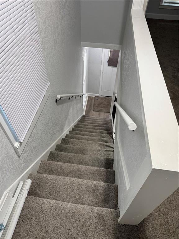 116 N Home St, Independence, MO 64053 - staircase with a textured wall