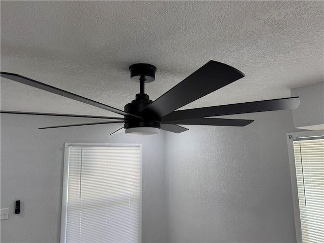 116 N Home St, Independence, MO 64053 - detailed view of a ceiling fan, a textured ceiling, and a textured wall