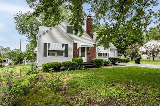 2738 S Crysler Ave, Independence, MO 64052 - bungalow with a chimney, concrete driveway, and an attached garage