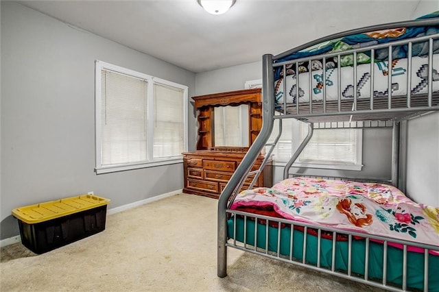 2738 S Crysler Ave, Independence, MO 64052 - carpeted bedroom with baseboards and multiple windows