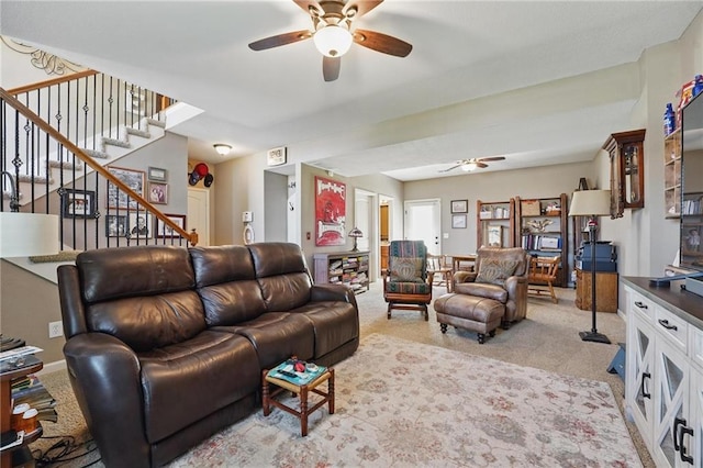 1037 NW 91st Ter, Kansas City, MO 64155 - living room with a ceiling fan, light colored carpet, and stairway