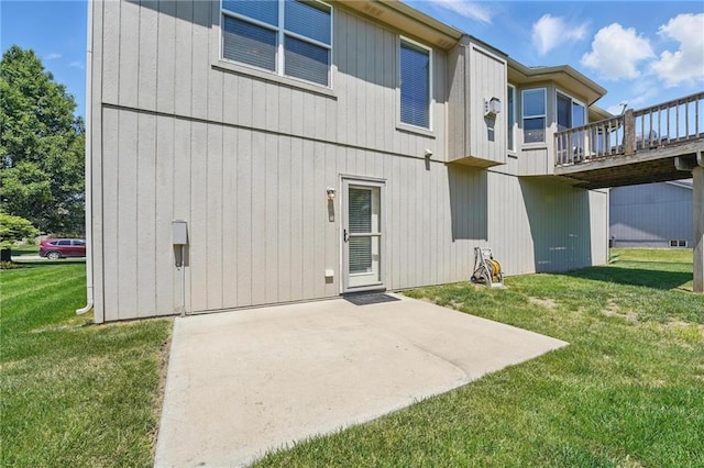 1037 NW 91st Ter, Kansas City, MO 64155 - back of house with a patio, a lawn, and a deck
