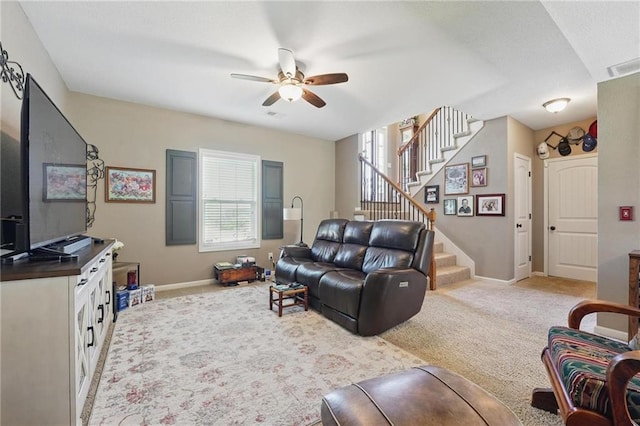 1037 NW 91st Ter, Kansas City, MO 64155 - carpeted living room with a ceiling fan, stairs, and baseboards