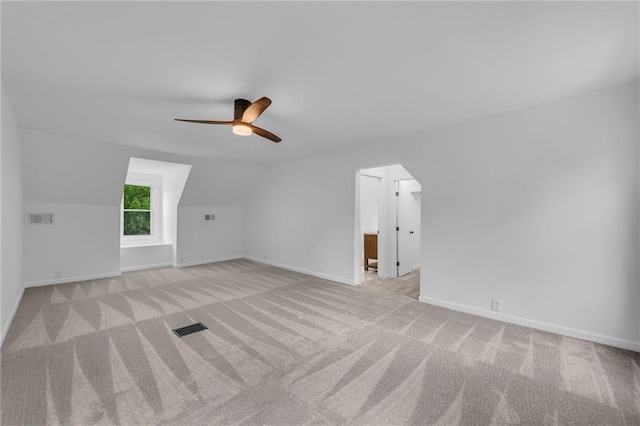 706 W Cedar St, Olathe, KS 66061 - additional living space featuring carpet, ceiling fan, baseboards, vaulted ceiling, and arched walkways