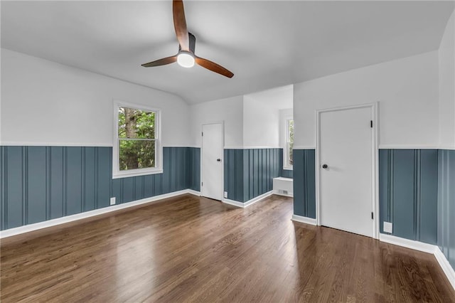 706 W Cedar St, Olathe, KS 66061 - unfurnished room featuring a wainscoted wall, ceiling fan, and wood finished floors