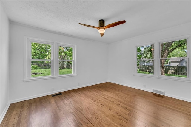 706 W Cedar St, Olathe, KS 66061 - empty room featuring ceiling fan, wood finished floors, baseboards, and ornamental molding
