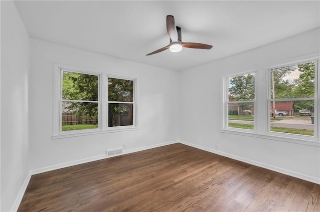 706 W Cedar St, Olathe, KS 66061 - spare room with dark wood finished floors, baseboards, and ceiling fan