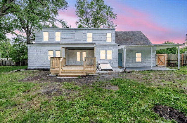 706 W Cedar St, Olathe, KS 66061 - rear view of property with a wooden deck and roof with shingles