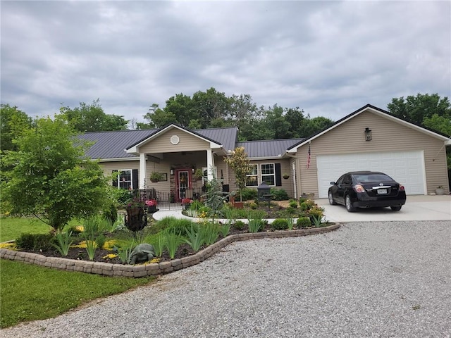 1154 SE 364p Rd, Clinton, MO 64735 - ranch-style home featuring concrete driveway, an attached garage, and metal roof