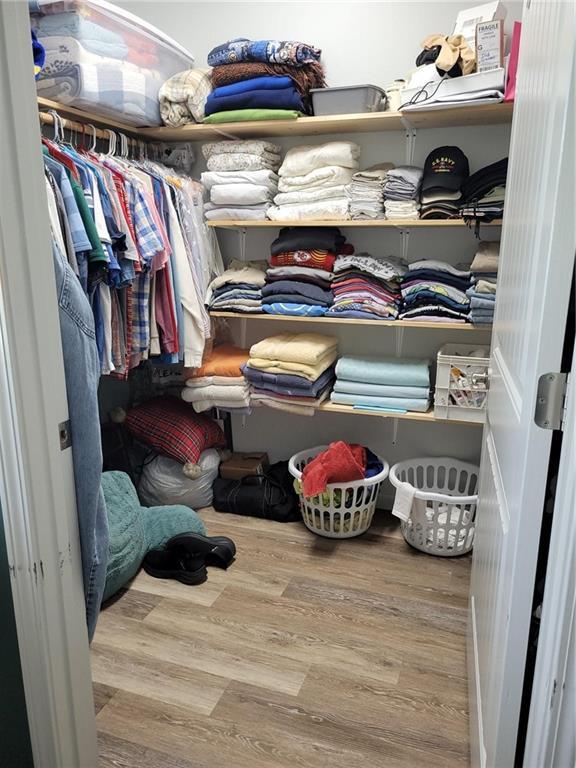 1154 SE 364p Rd, Clinton, MO 64735 - walk in closet with wood finished floors
