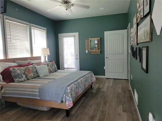1154 SE 364p Rd, Clinton, MO 64735 - bedroom with baseboards, wood finished floors, and ceiling fan