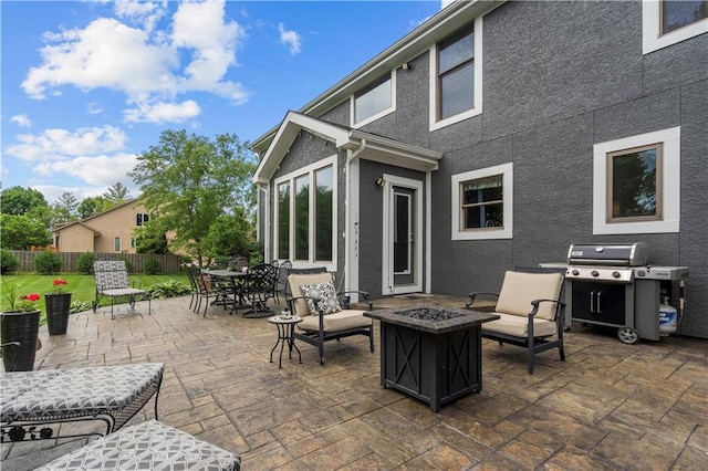 15801 Parkhill St, Overland Park, KS 66221 - view of patio with an outdoor fire pit, grilling area, and outdoor dining space
