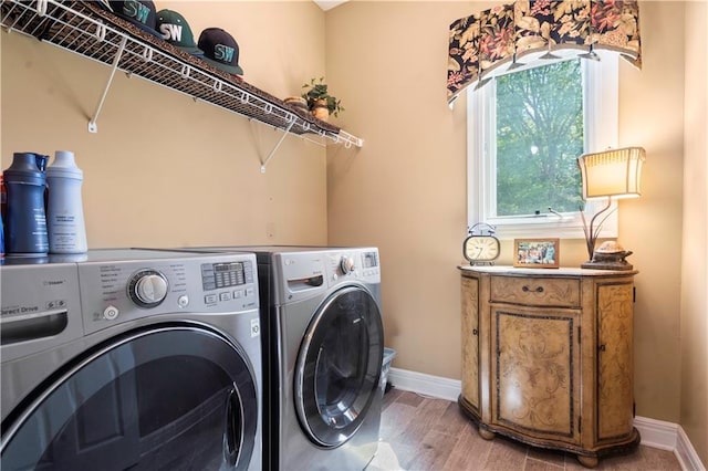 15801 Parkhill St, Overland Park, KS 66221 - washroom featuring separate washer and dryer, baseboards, and light wood-type flooring