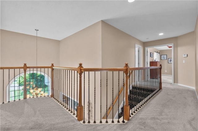 15801 Parkhill St, Overland Park, KS 66221 - hall with carpet, an upstairs landing, baseboards, and recessed lighting