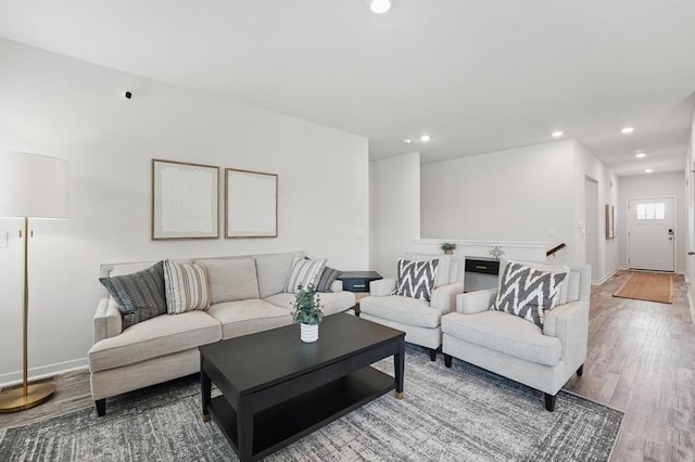 2208 Crestview Pl, Raymore, MO 64083 - living room featuring wood finished floors, recessed lighting, and baseboards