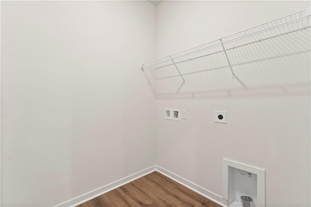 2208 Crestview Pl, Raymore, MO 64083 - washroom featuring electric dryer hookup, hookup for a washing machine, baseboards, and dark wood finished floors