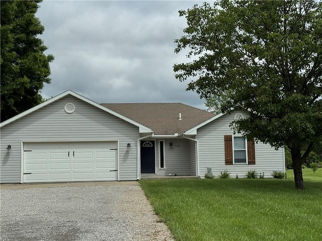 113 N Elm St, Lathrop, MO 64465 - ranch-style house with a garage, a front yard, driveway, and roof with shingles
