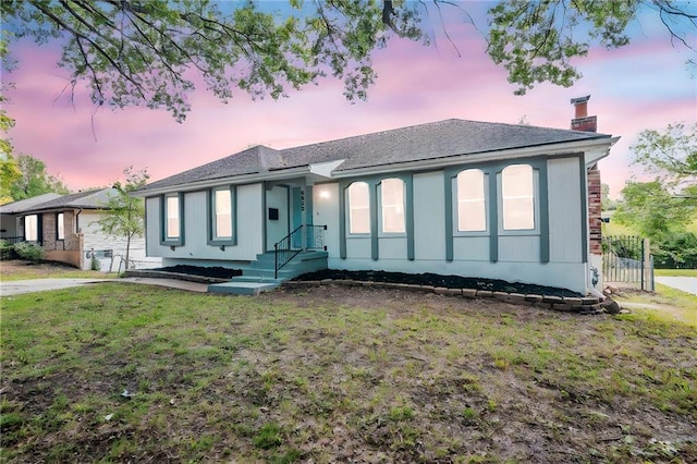 8823 E 111th St, Kansas City, MO 64134 - ranch-style house featuring a chimney, a yard, and roof with shingles