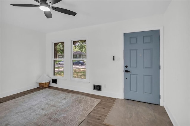 8823 E 111th St, Kansas City, MO 64134 - foyer with a ceiling fan, baseboards, and wood finished floors