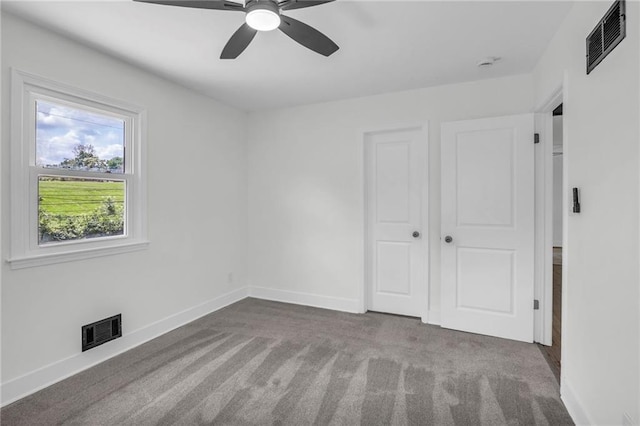 8823 E 111th St, Kansas City, MO 64134 - unfurnished bedroom with carpet floors, baseboards, a ceiling fan, and a closet