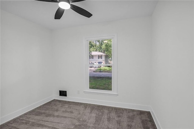 8823 E 111th St, Kansas City, MO 64134 - empty room featuring carpet flooring, baseboards, and ceiling fan