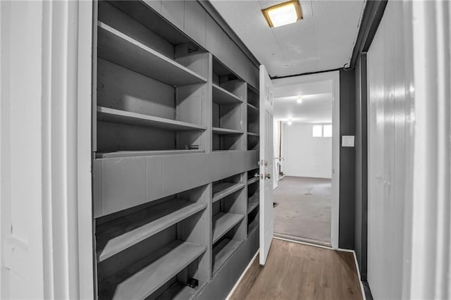 8823 E 111th St, Kansas City, MO 64134 - spacious closet featuring wood finished floors