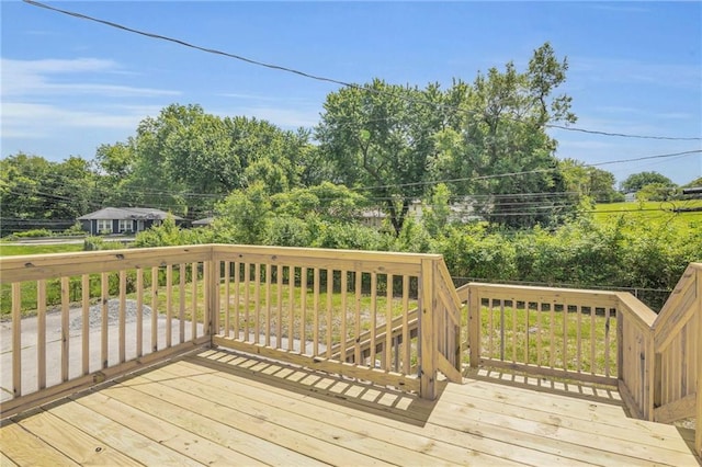 8823 E 111th St, Kansas City, MO 64134 - wooden deck with view of scattered trees