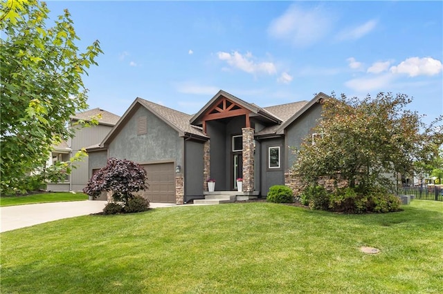 8756 Houston St, Lenexa, KS 66227 - view of front facade featuring concrete driveway, a garage, stucco siding, and stone siding