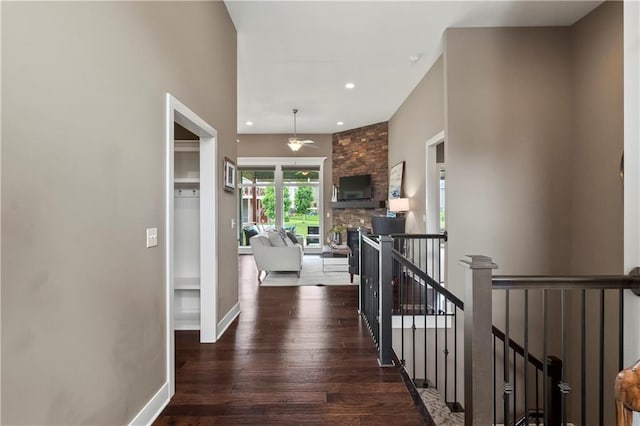 8756 Houston St, Lenexa, KS 66227 - hallway with an upstairs landing, wood finished floors, and recessed lighting