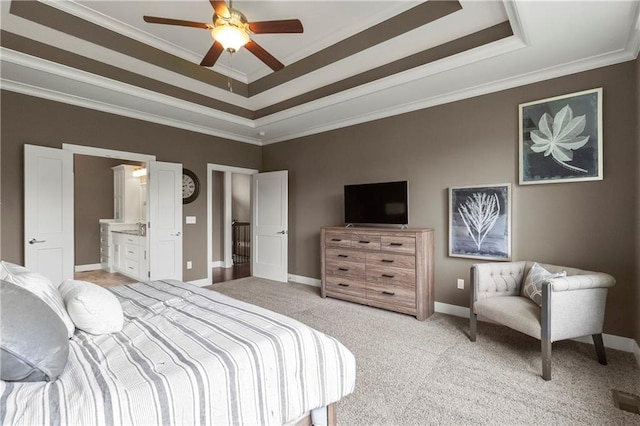 8756 Houston St, Lenexa, KS 66227 - bedroom featuring a tray ceiling, light carpet, crown molding, ensuite bathroom, and ceiling fan