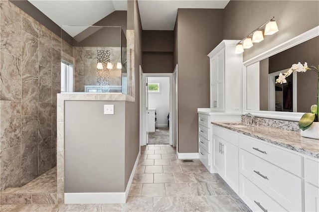 8756 Houston St, Lenexa, KS 66227 - bathroom with vanity, walk in shower, and lofted ceiling