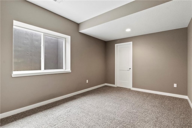 8756 Houston St, Lenexa, KS 66227 - carpeted spare room featuring baseboards and recessed lighting