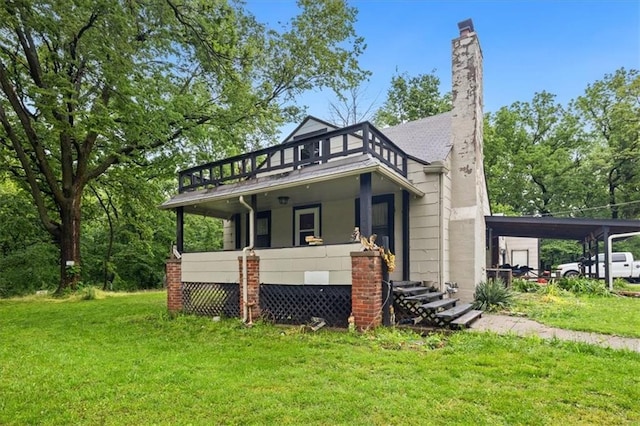 7508 Walnut St, Pleasant Valley, MO 64068 - view of front of property featuring a front lawn, an attached carport, a chimney, and a balcony