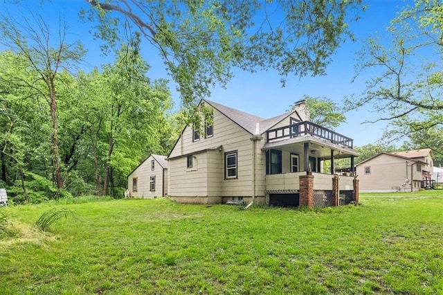 7508 Walnut St, Pleasant Valley, MO 64068 - back of property featuring a yard and a chimney