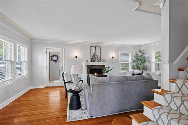 7224 Ward Pkwy, Kansas City, MO 64114 - living area featuring a premium fireplace, crown molding, wood finished floors, stairs, and baseboards