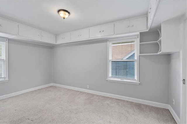 7224 Ward Pkwy, Kansas City, MO 64114 - empty room with carpet floors, baseboards, and plenty of natural light