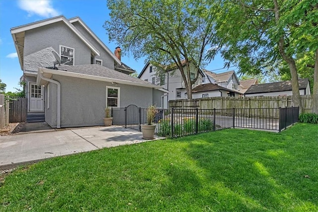 7224 Ward Pkwy, Kansas City, MO 64114 - rear view of house with stucco siding, a gate, a patio, and roof with shingles