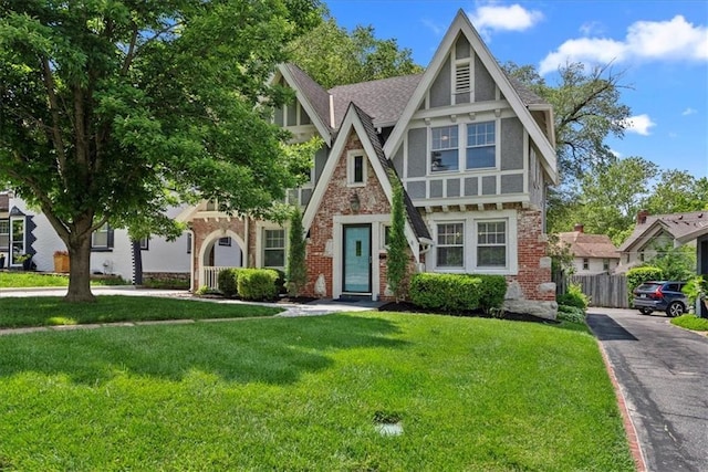7224 Ward Pkwy, Kansas City, MO 64114 - tudor-style house with brick siding and stucco siding