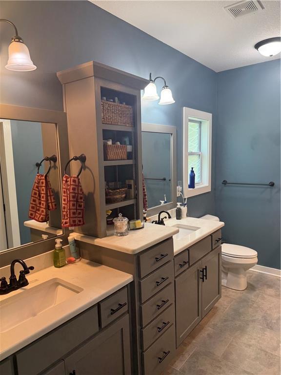 481 Sycamore Ct, Warrensburg, MO 64093 - bathroom with vanity and toilet