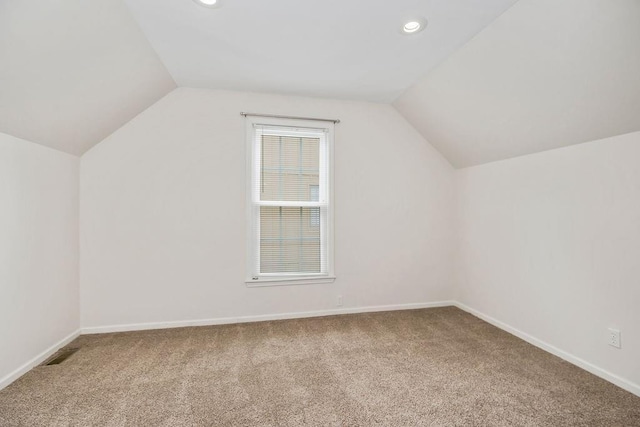 8122 Parkhill Rd, Lenexa, KS 66215 - additional living space with vaulted ceiling, carpet flooring, recessed lighting, and baseboards