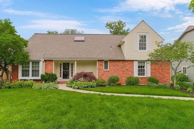 8122 Parkhill Rd, Lenexa, KS 66215 - view of front of house featuring brick siding, a front yard, and a shingled roof